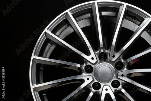 close-up of alloy wheel, thin light spoke, sports car rim, front view