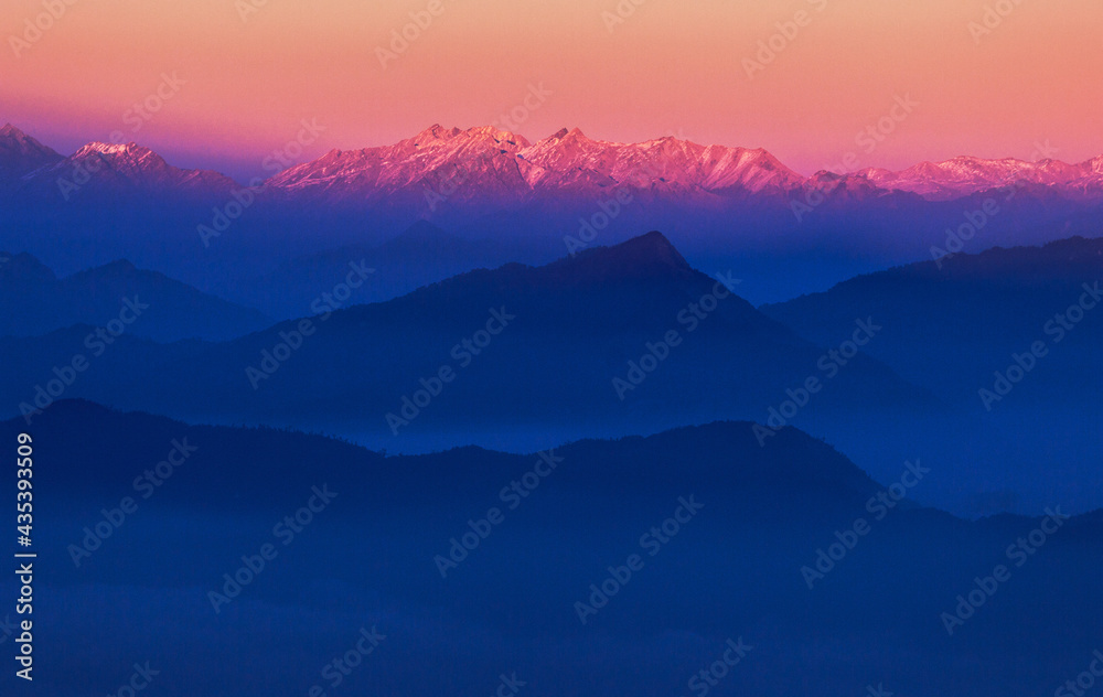 Bright dawn over the mountains sky gradient 