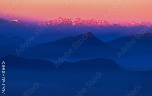 Bright dawn over the mountains sky gradient 