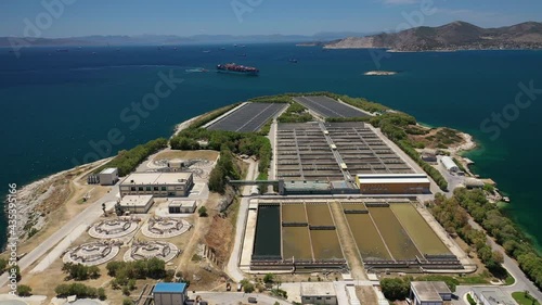 Aerial drone video of latest technology sewage and sludge processing plant in small island of Psitalia or Psyttaleia, Piraeus, Attica, Greece photo