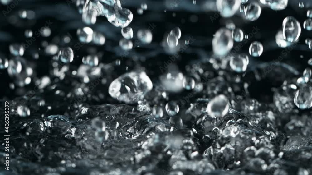 Super slow motion of dripping water isolated on blue background. Filmed on high speed cinema camera, 1000 fps. Super slow motion of dripping water isolated on blue background. Filmed on high speed cinema camera, 1000 fps.