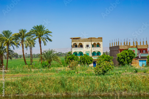 Buildings on the Nile canal near Qena, Egypt photo