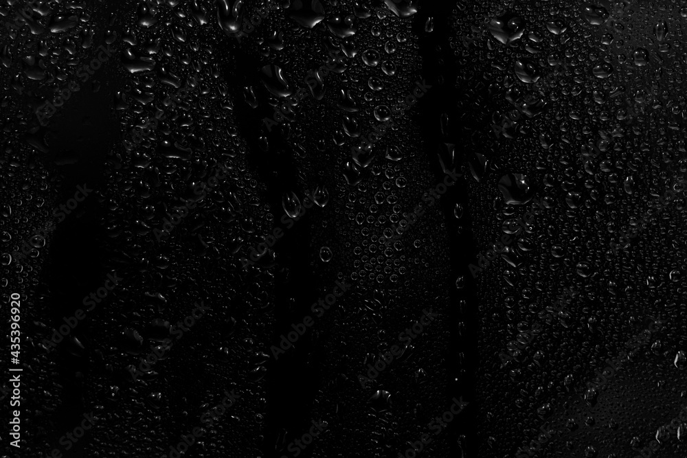 water drops on black background. abstract dew water droplets on a
