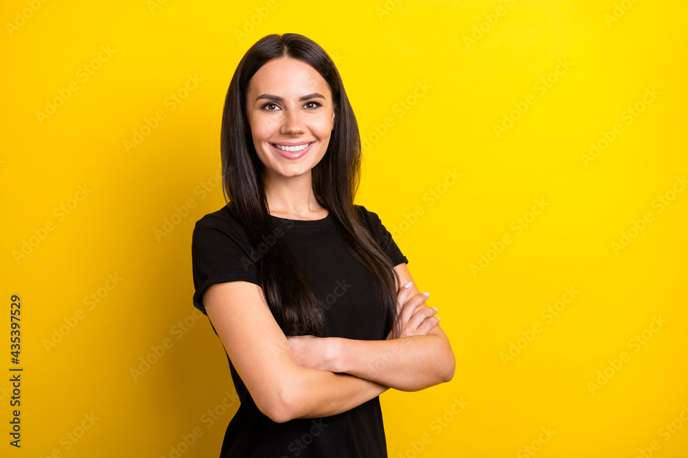 Profile photo of gorgeous satisfied person crossed hands beaming smile isolated on yellow color background Profile photo of gorgeous satisfied person crossed hands beaming smile isolated on yellow color background