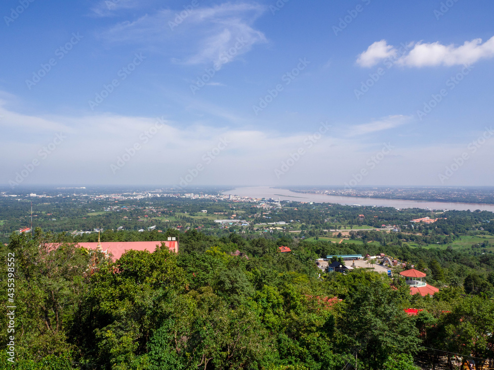 Amazing bird's-eye view mountain scenery of summer, blue sky, town near .Mekong River in Thailand.