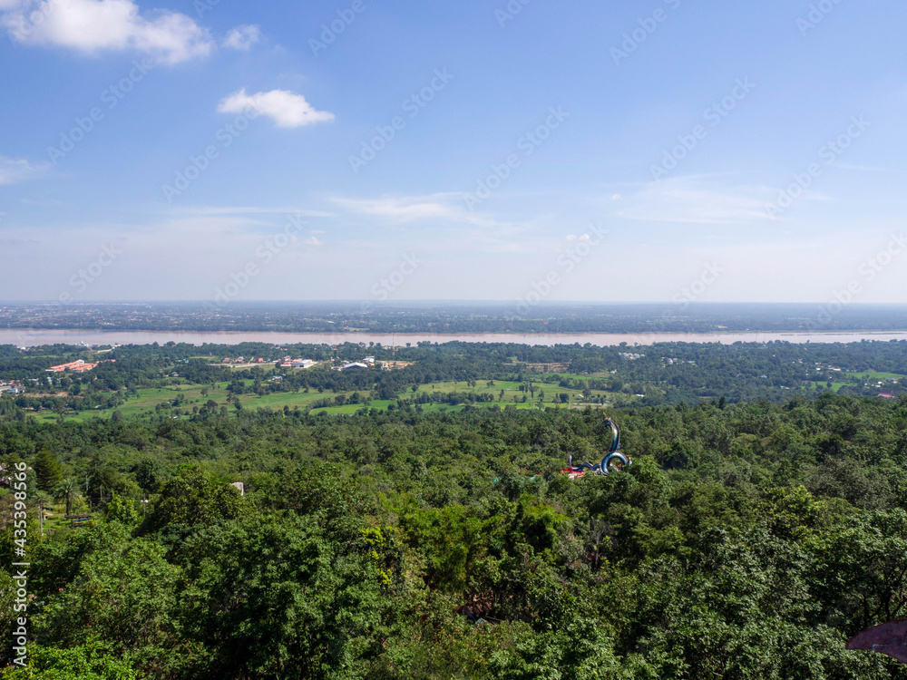 Amazing bird's-eye view mountain scenery of summer, blue sky, big Naga statue near .Mekong River in Thailand.