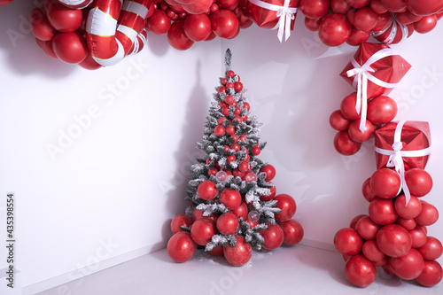 christmas decorations with colored balloons on background