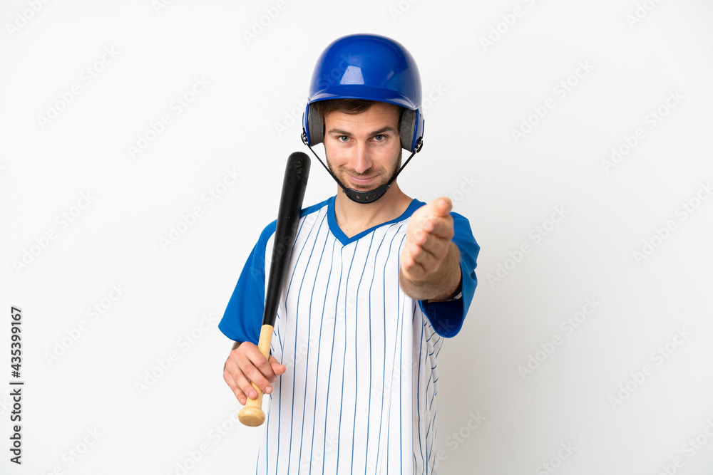Young caucasian man playing baseball isolated on white background shaking hands for closing a good deal