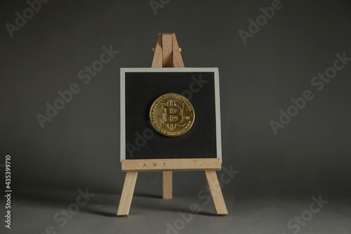 NFT non-fungible token crypto art on grey background. Pay for unique collectibles in art. NFT crypto art collectibles concept. Minimal concept photo