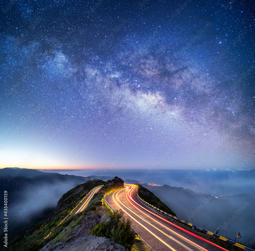 Astrophotography shot of hairpin turn with galactic core milky way rising on Madeira Island, Portugal - obrazy, fototapety, plakaty 