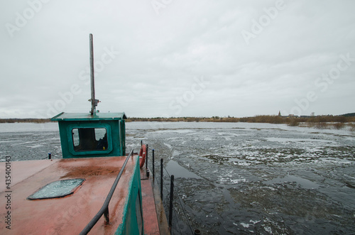 Crossing by boat during high water  photo