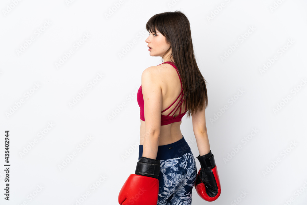 Young sport woman isolated on white background with boxing gloves