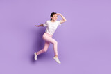 Full body profile side photo of young girl happy positive smile jump run look ahead sale isolated over violet color background