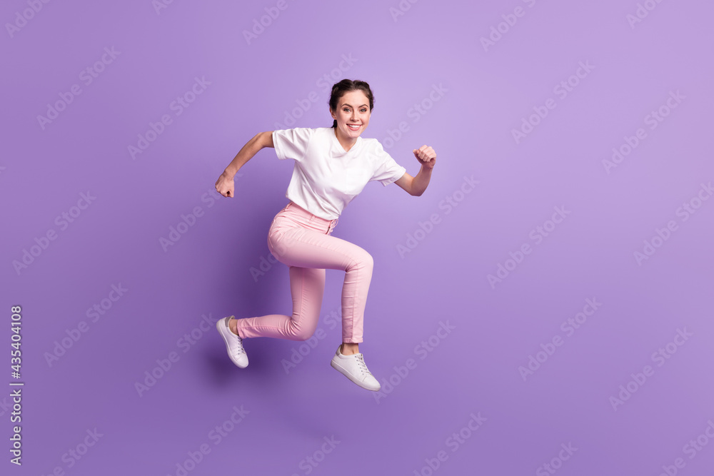 Full size profile portrait of energetic charming lady rush toothy smile look camera isolated on purple color background