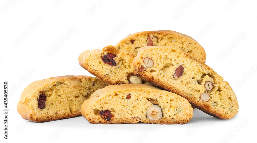 Slices of tasty cantucci with berry and pistachio on white background. Traditional Italian almond biscuits Slices of tasty cantucci with berry and pistachio on white background. Traditional Italian almond biscuits