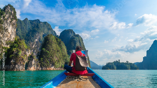 Man traveler on boat joy nature view rock island scenic landscape Khao Sok National park, Attraction famous travel adventure place Thailand, Tourism beautiful destinations Asia holiday vacation trip © day2505