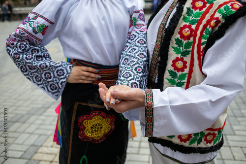 Ukrainian national clothing - embroideries. Young people in embroidered shirts dance