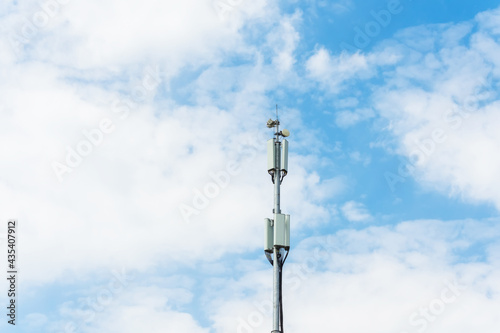 Cellular macro Base Transceiver Station. Telecommunication tower. Wireless Communication Antenna Transmitter. Development of communication systems in urban area sky.