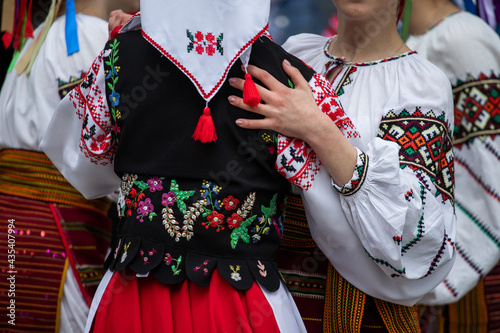 Ukrainian national clothing - embroideries. Young people in embroidered shirts dance