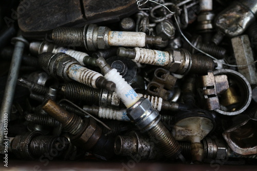 Kuwait City – Kuwait – April 15, 2021: Used and discarded auto spark plugs