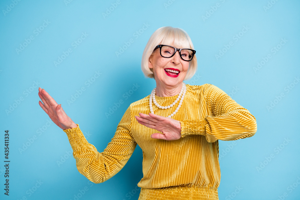 Photo of funky short hairdo senior lady dance wear blouse eyewear isolated  on blue color background Stock Photo | Adobe Stock