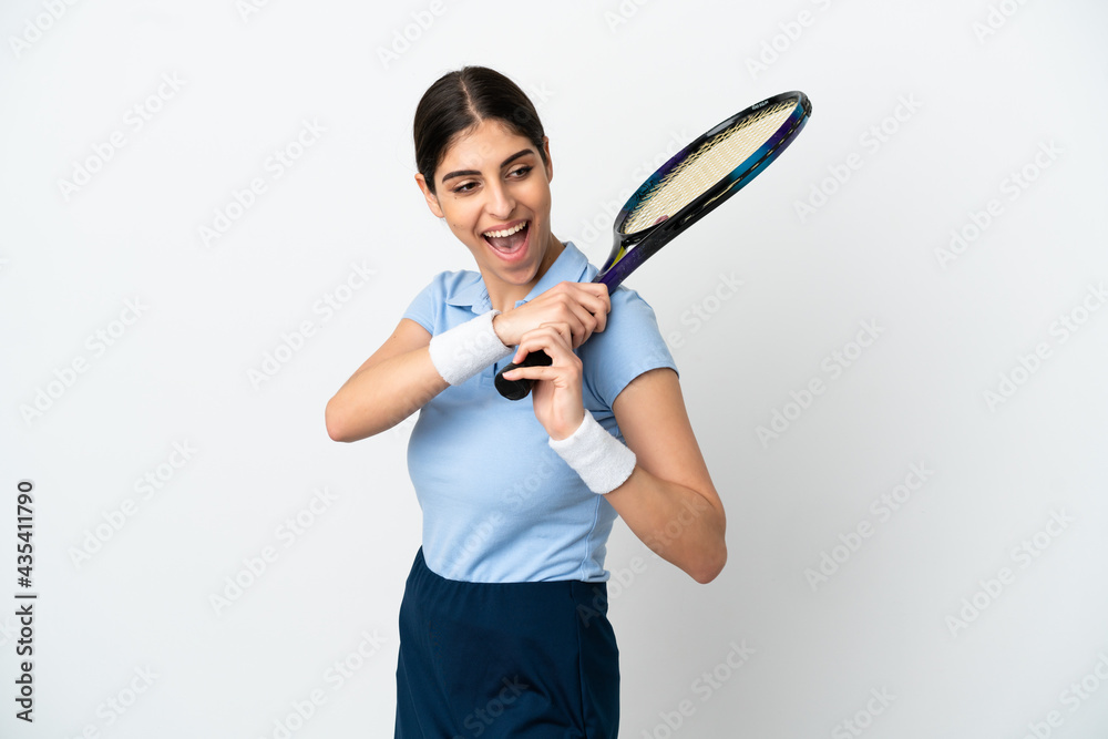 Young caucasian woman isolated on white background playing tennis Young caucasian woman isolated on white background playing tennis