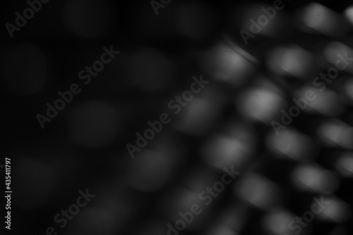 Black and white blue bokeh background.