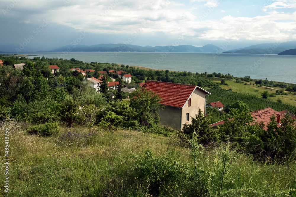 Panorama of Prespa lake, in the southern of the Republic of Northern Macedonia, in an early spring morning, with moutains in background. Prespansko ezero is a major attraction...