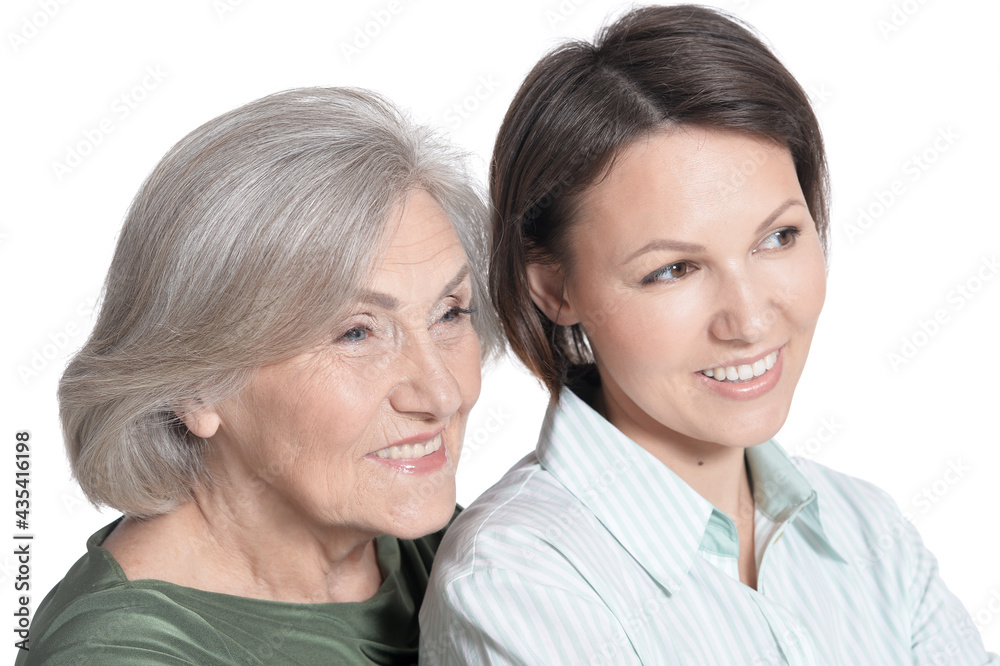 close up portrait of mother and her adult daughter hugging isolated on white close up portrait of mother and her adult daughter hugging isolated on white
