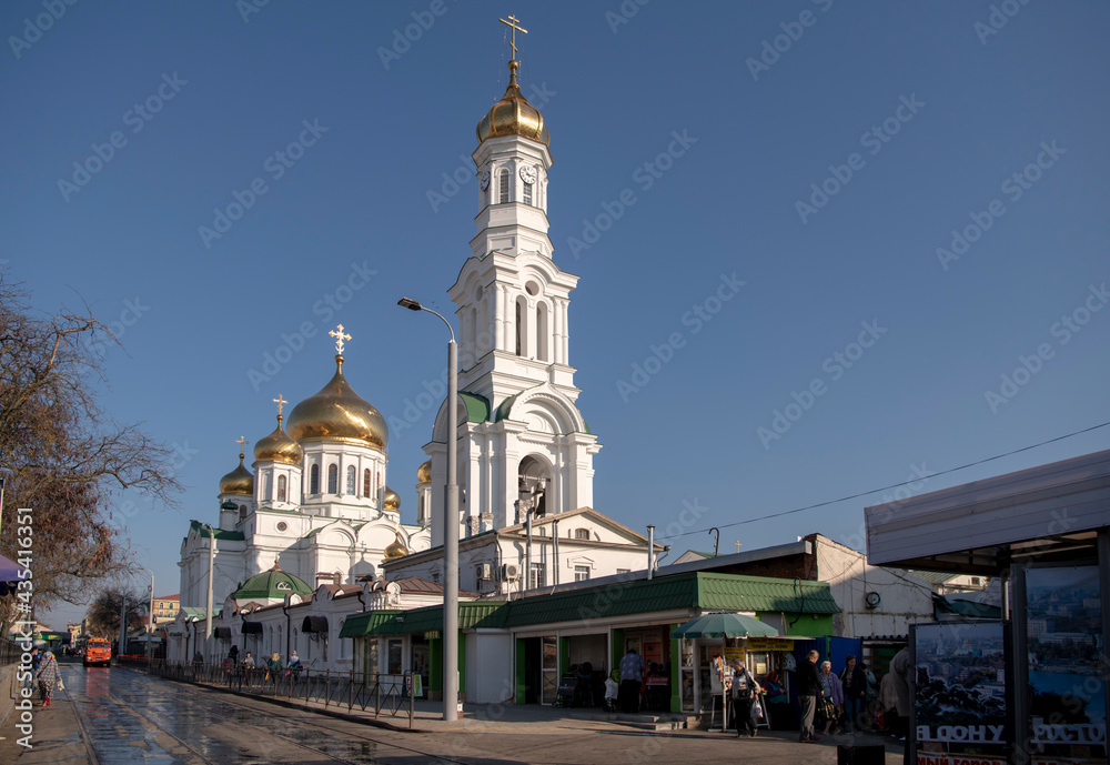  Rostov Cathedral of the Nativity of the Blessed Virgin. Citizens walk near the cathedral