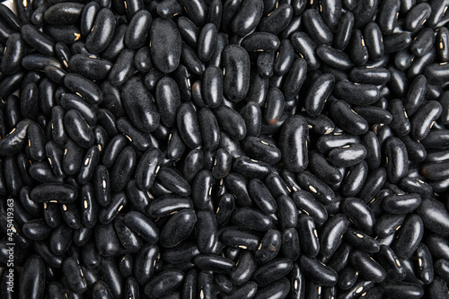 Heap of black beans as background, top view. Veggie seeds