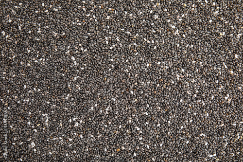 Heap of chia seeds as background, top view. Veggie food photo