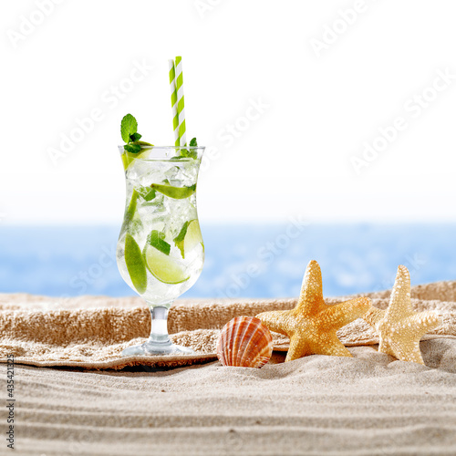 Fototapeta Naklejka Na Ścianę i Meble -  Cold summer drink on beach and free space for your decoration 