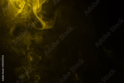 Yellow and pink steam on a black background.