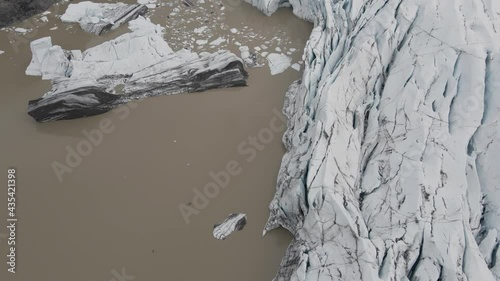 Small icebergs in Svinafellsjokull Glacier lagoon, Iceland. Aerial top-down forward photo