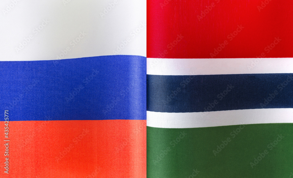 fragments of the national flags of Russia and the Republic of the Gambia close-up fragments of the national flags of Russia and the Republic of the Gambia close-up