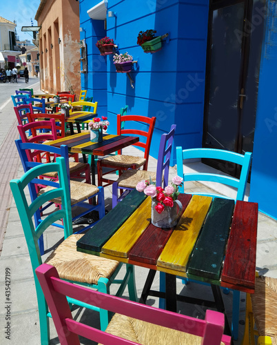 restaurant cafe in preveza city greece multicolortables and chairs flowers pots