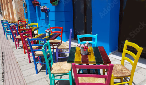 restaurant cafe in preveza city greece multicolortables and chairs flowers pots © sea and sun
