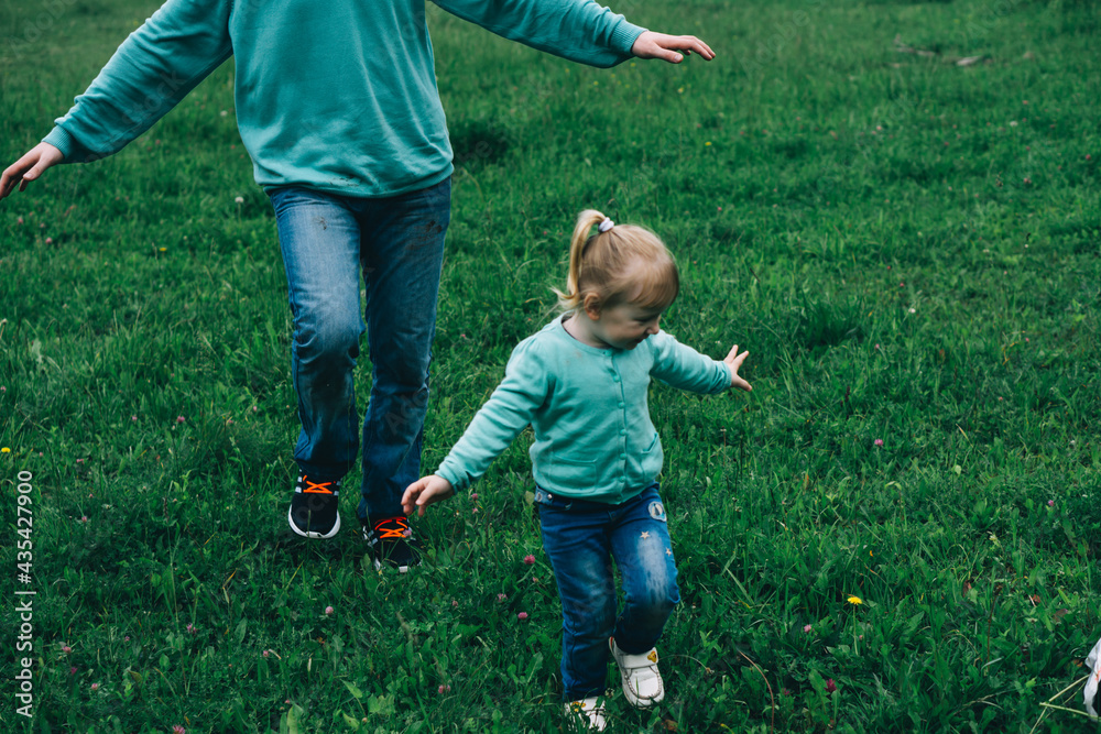 Father Runs With Daughter In A Green Field International Day Of Men father-runs-with-daughter-in-a-green-field-international-day-of-men