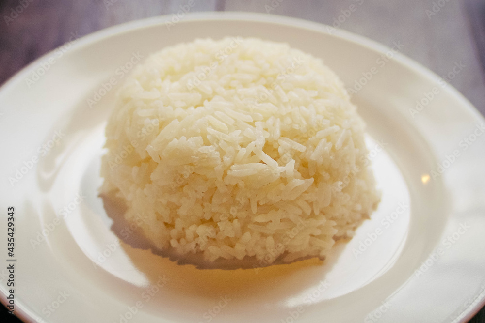 cooked stream Rice in white plate cooked stream Rice in white plate