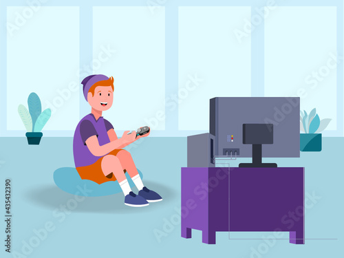 Boy with hat plays video games on his console on the screen