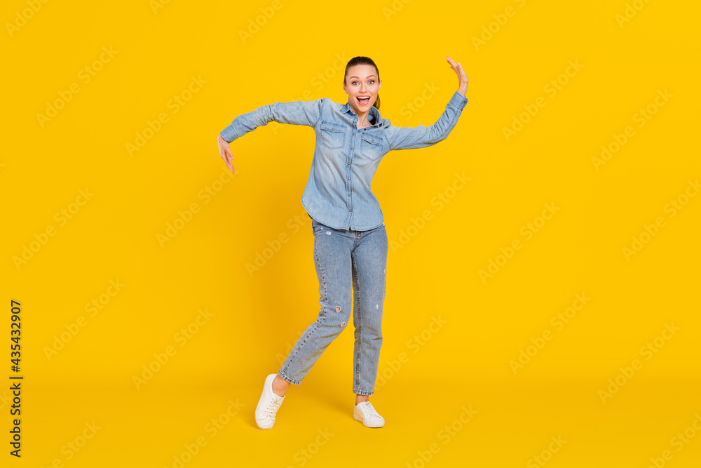 Full length body size photo cheerful careless girl dancing at party relaxing on weekend isolated bright yellow color background