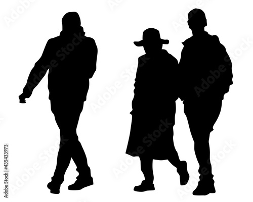 Man and women walking on street. Isolated silhouette on a white background