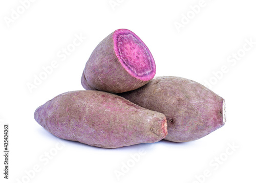 Purple sweet potato and half purple sweet potato on white background