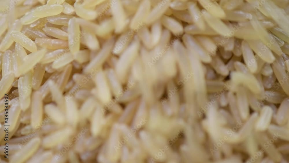 Brown rice, Macro shot, Brown rice slowly falling. Brown rice, Macro shot, Brown rice slowly falling.