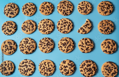 Chocolate sweet cookies background over blue background.
