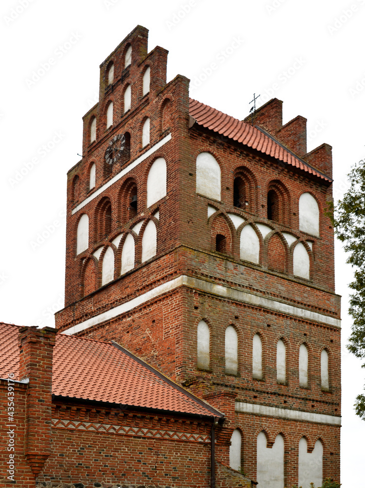 General view and architectural details in close. Catholic church dedicated to the Assumption of the Blessed Virgin Mary. Built in the second half of the 14th century in the town of Galiny, warmi in Po