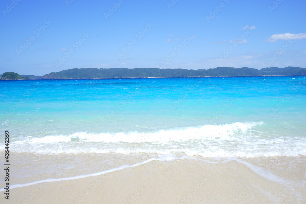 Beautiful summer scenery. calm waves on the blue water. Furuzamami Beach in Zamami island, Okinawa, Japan. Closeup - 日本 沖縄 座間味島 古座間味ビーチ 青い海