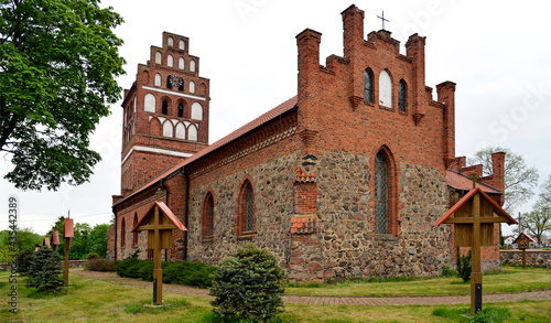 General view and architectural details in close. Catholic church dedicated to the Assumption of the Blessed Virgin Mary. Built in the second half of the 14th century in the town of Galiny, warmi in Po photo