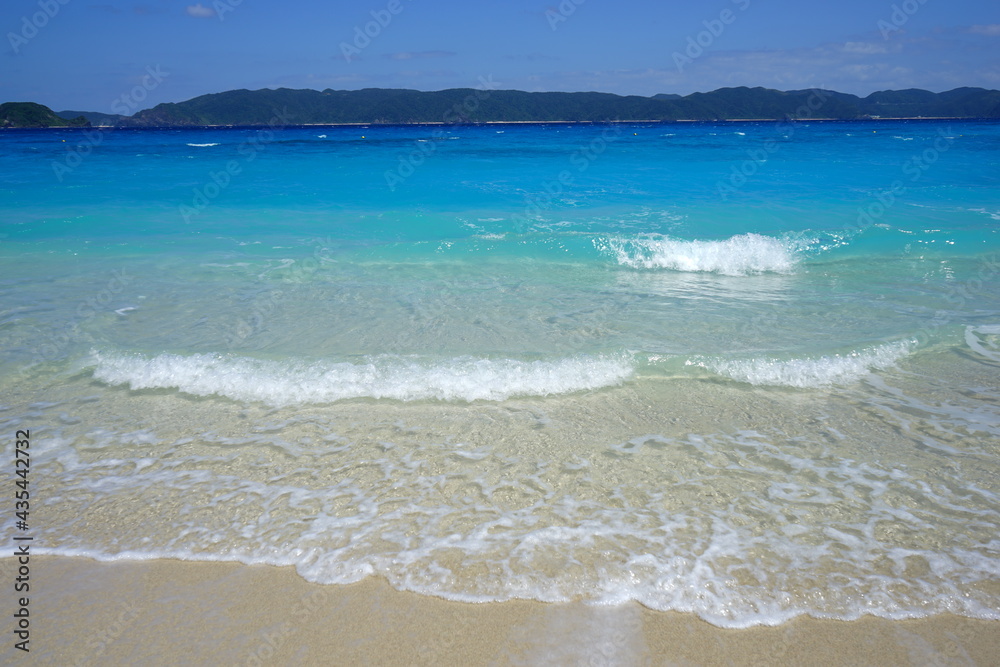 Fototapeta premium Beautiful summer scenery. calm waves on the blue water. Furuzamami Beach in Zamami island, Okinawa, Japan. Closeup - 日本 沖縄 座間味島 古座間味ビーチ 青い海